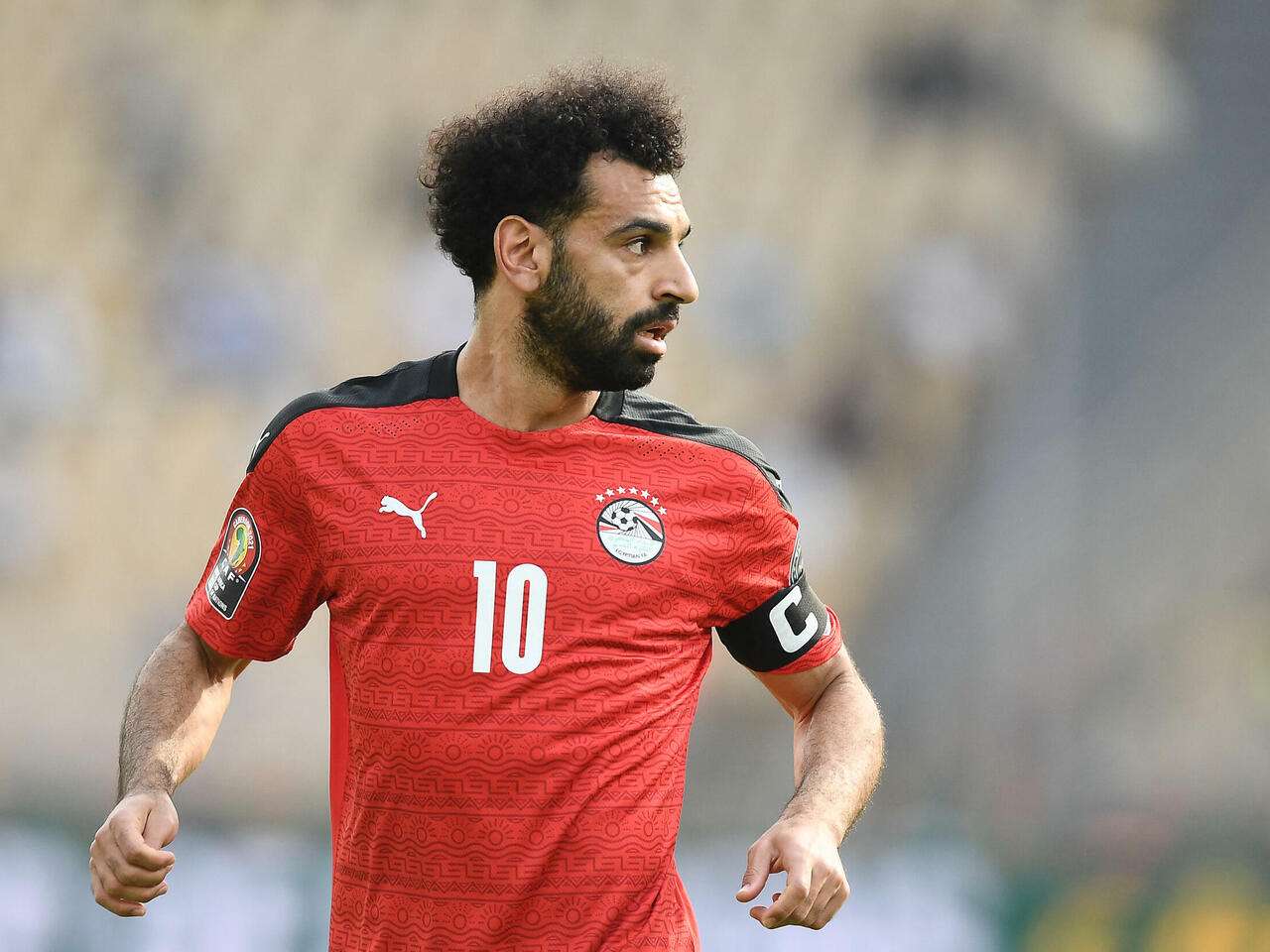 Egypt's forward Mohamed Salah reacts   during the Africa Cup of Nations (CAN) 2021 quarter-final football match between Egypt and Morocco at Stade Ahmadou Ahidjo in Yaounde on January 30, 2022. (Photo by CHARLY TRIBALLEAU / AFP)