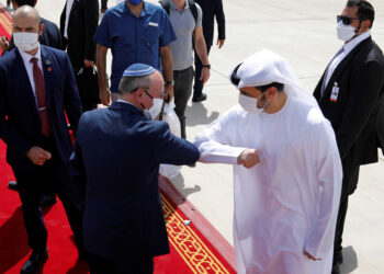 Israeli National Security Advisor Meir Ben-Shabbat elbow bumps with an Emirati official as he makes his way to board the plane to leave Abu Dhabi, United Arab Emirates September 1, 2020. REUTERS/Nir Elias/Pool